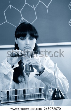Lab worker working with chemical lab equipment