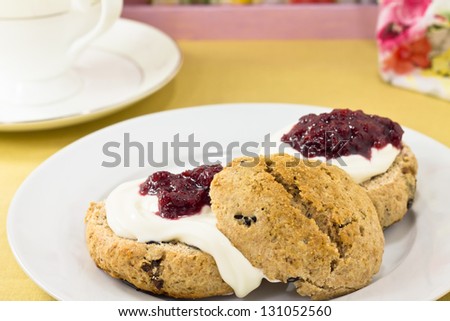 English scones  of whole wheat  with clotted cream and strawberry jam