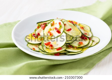 Marinated zucchini salad on a white plate