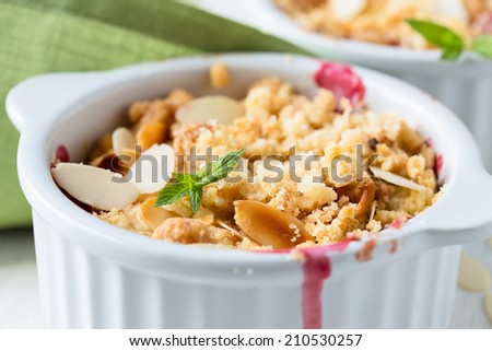 Fresh plum crumble. Organic natural food, stewed fruit topped with a crumbly mixture of butter, flour, and sugar