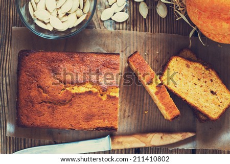 Homemade pound cake baked in a loaf pan on a wooden board  viewed from above