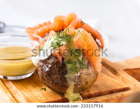 Crispy jacket potatoes with light soft cheese,  smoked salmon fillet and mustard sauce   toppings