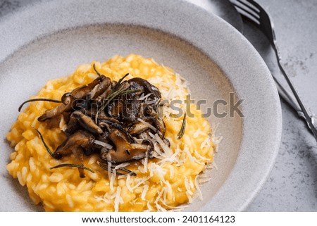 Similar – Rosemary on risotto with rabbit and mushrooms