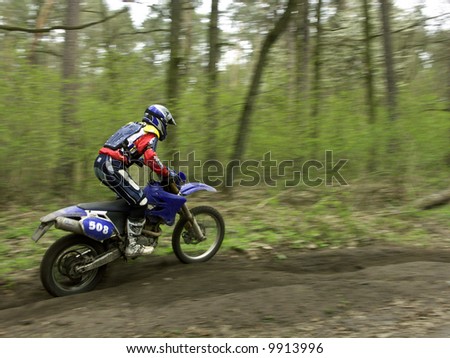 Motocross rider racing on a dirt track