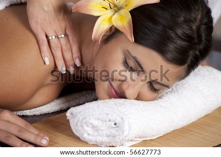 Beautiful young lady in spa salon