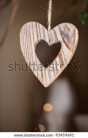 Wooden heart hanging on the wall