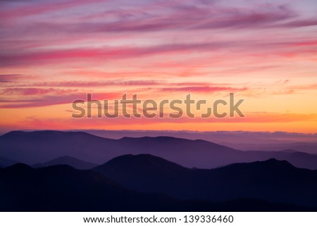 View past Mansfield at sunset from the summit of Mt Buller in Victoria, Australia