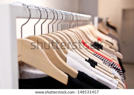 Clothes hang on a shelf in a designer clothes store in Melbourne, Australia