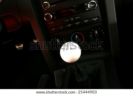 View of a stick shift in front of console