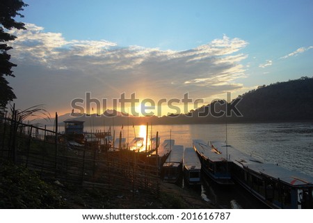 Sunset with Fishing boat on Mekong river in Luang Prabang City at Loas Lao People s Democratic Republic