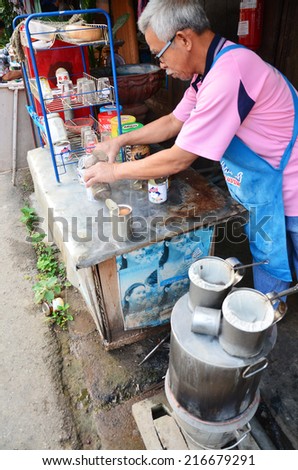 PHARE, THAILAND - APRIL 29 : Old man made breakfast and coffee thai style at morning on April 29, 2011 in Phare Thailand