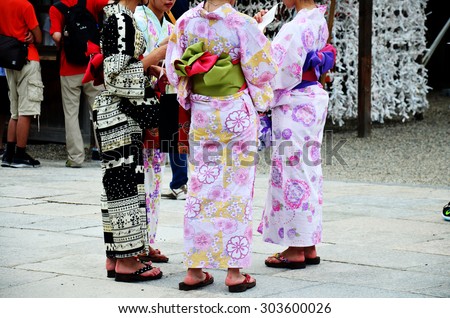 KYOTO, JAPAN - JULY 11 : Japanese people wear traditional Japanese clothing (Kimono and Yukatas) walking to inside at Yasaka shrine or Gion Shrine on July 11, 2015 in Kyoto, Japan