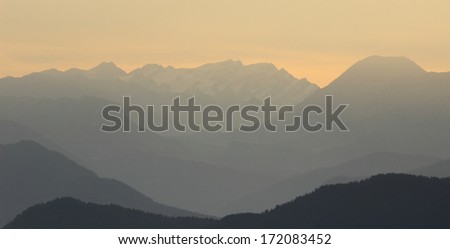Sunrise over mountains silhouettes