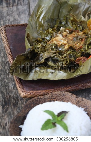 Botok-Botok Johor - Southern Malaysia Traditional Cuisine. Fish wrap with herbs, vegetables and steamed in Banana leaf