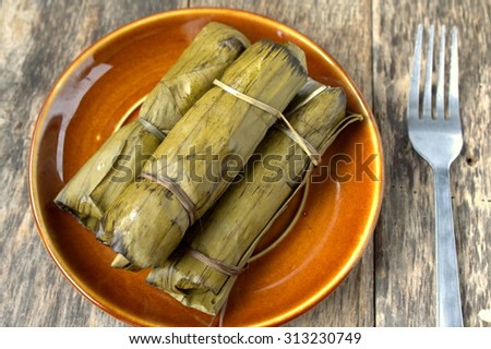Tamales are a mix of meat and vegetables with rice or corn folded in a banana leaf and then steamed.