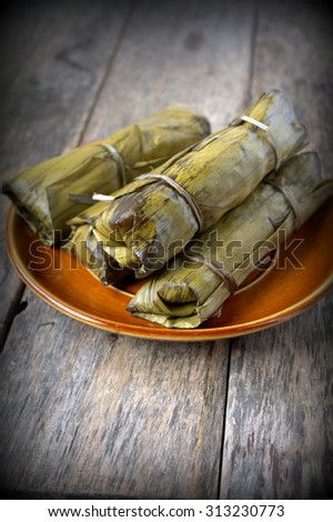 Tamales are a mix of meat and vegetables with rice or corn folded in a banana leaf and then steamed.