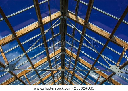 Steel construction with wood and glass, roof of the greenhouse