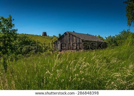 lonely old wooden barn in a field