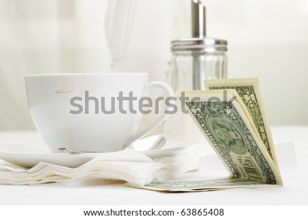 Dollar banknotes laying down on receipt for coffee payment