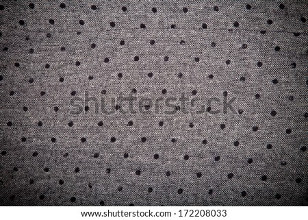 gray material with black circles background