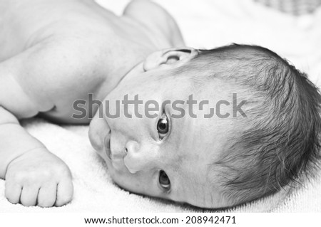 black and white portrait of a newborn baby close-up, shallow depth of field