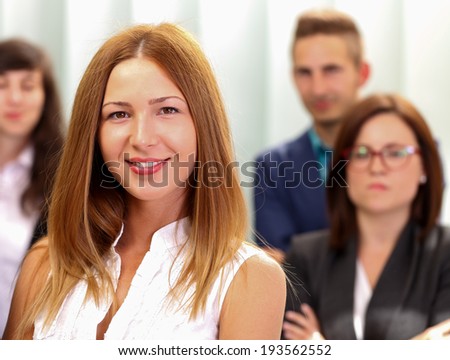 A beautiful business woman standing in office