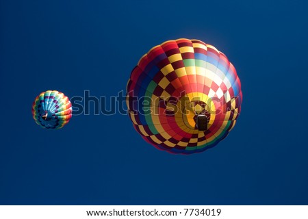 Hot air balloons in flight on a summer evening