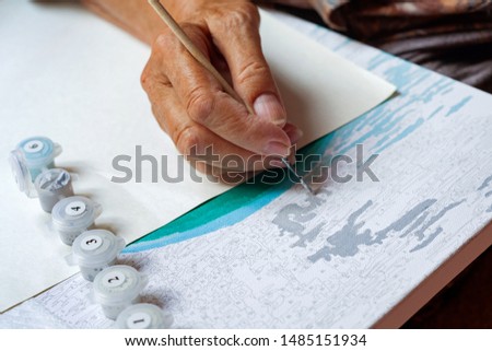 Similar – Image, Stock Photo Older woman painting on a notebook