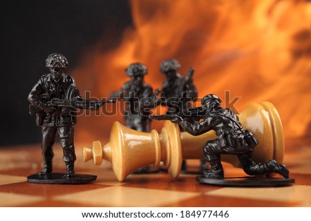 Chess King death. Toy soldiers kill chess King in fire.