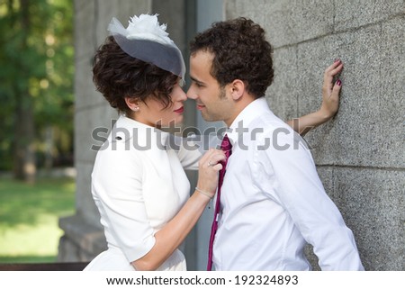 Wedding theme. Bride passionately presses the groom against the wall