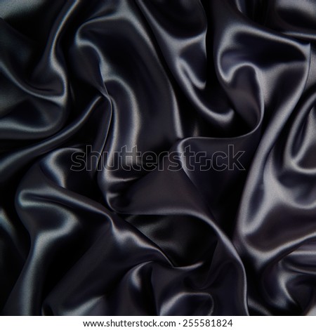 abstract background luxury cloth or liquid wave or wavy folds of grunge dark silver silk texture satin velvet material or luxurious