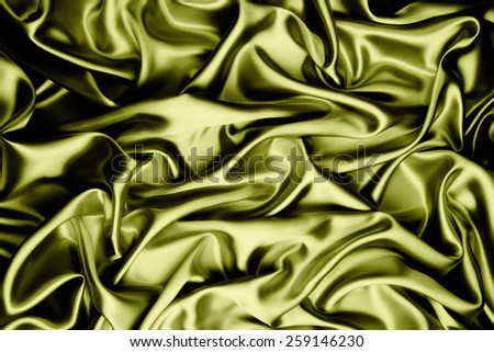 abstract background luxury cloth or liquid wave or wavy folds of grunge yellow silk texture satin velvet material or luxurious