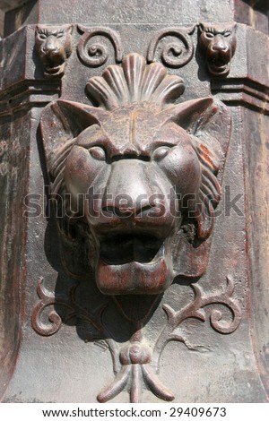 Antique bronze lion face