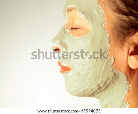 Woman in a health spa wearing a facial mask