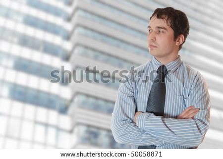 Handsome, confident businessman outside of corporate building
