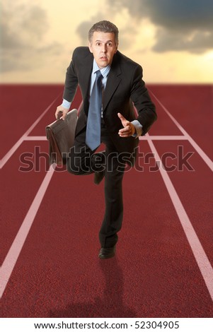 Business man running on a track