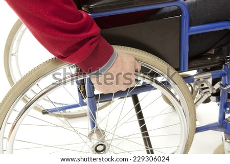 Wheelchair user makes various movements with his wheelchair, exercises for safety handling