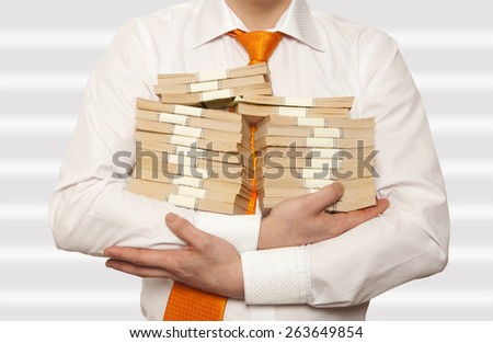 Businessman holding a stack of cash