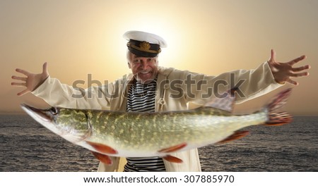 Joyful fisherman with big fish