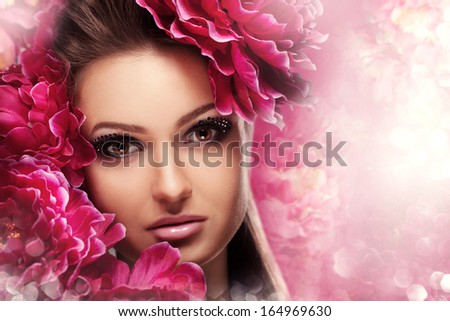 Beauty Girl With peonies Flowers. Beautiful Model Woman Face. Perfect Skin. Professional Make-up.Makeup. Fashion Art