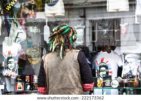 London, England - May 28. Man with dreadlock window shopping at Notting Hill on May 28, 2014 in London, England.