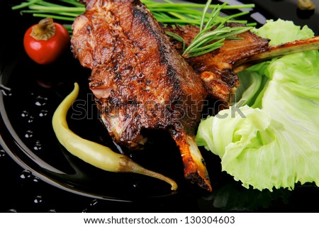 main course: barbecued ribs served with capers and chives