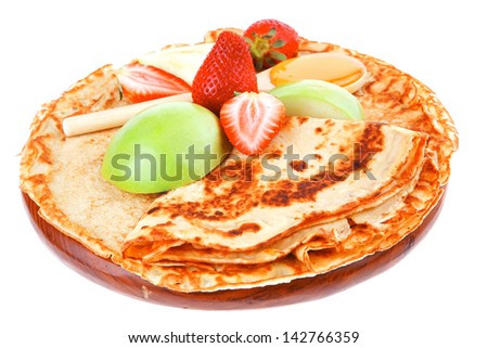 baked food : pancake with honey strawberries and apple isolated on white background