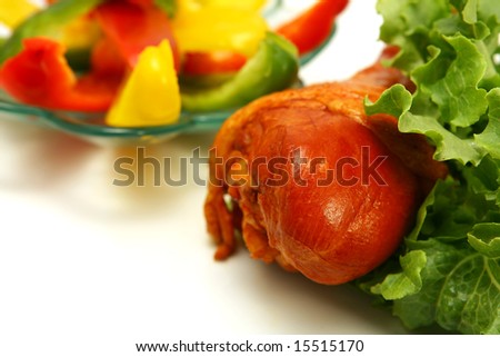 roasted turkey close up with raw vegetables
