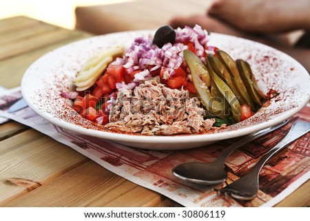 greece salad served on big white dish