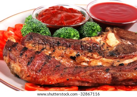 roast juicy fat steak and red hot sauces