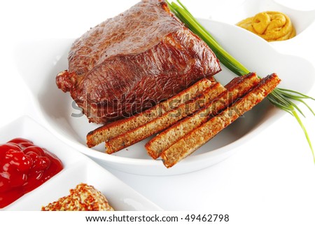 beef and bread on round white dish