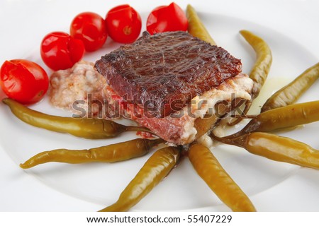 roast beef steak in melted yellow cheese on white