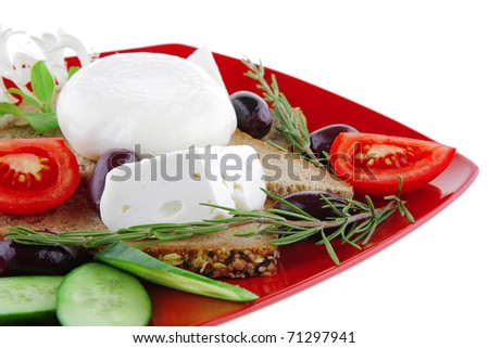 mozzarella cheese on red with bread and olives