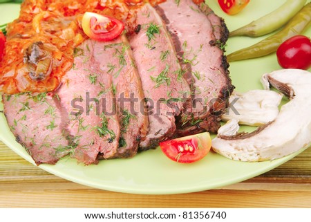 corned beef on plate over wooden table